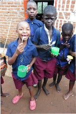 Malawi children receiving porridge from Mary's Meals