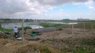 Flexigester site looking across waste ponds in Dar es Salaam