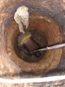 Hand emptying of pit latrine